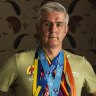 Joseph Moran wears the medals from every major marathon he has won.