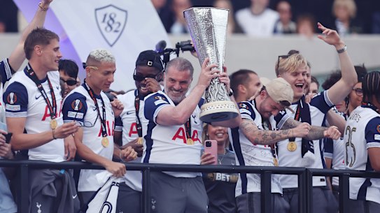 LONDON, ENGLAND - MAY 23: Ange Postecoglou, Manager of Tottenham Hotspur, lifts the UEFA Europa League trophy during the Tottenham Hotspur UEFA Europa League trophy parade on May 23, 2025 in London, England. Spurs defeated Manchester United in the final in Bilbao on May 21 to win their first major trophy in 17 years. (Photo by Harry Murphy/Getty Images)