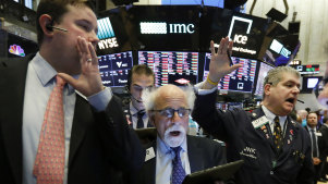 The tide's gone out: New York Stock Exchange Floor Governor Brendan Connolly with traders on the floor of the NYSE amid this week's market carnage.