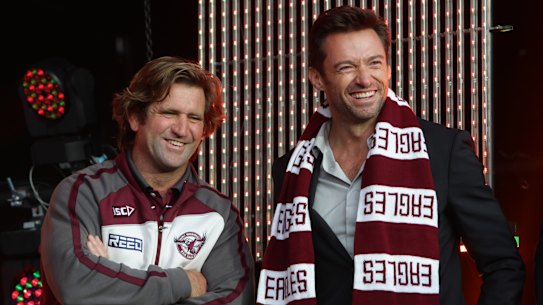 Sea Eagles fan Hugh Jackman talks to Manly coach Des Hasler in 2011.