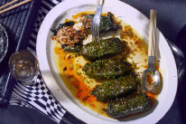 Kale rolls with spicy merguez sausage and rice.