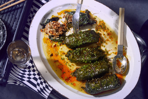 Kale rolls with spicy merguez sausage and rice.