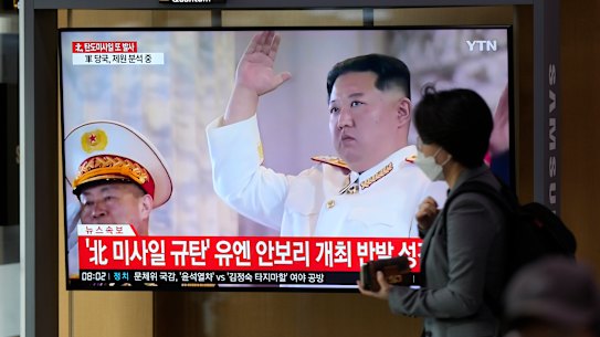 A TV screen showing a news program reporting about North Korea’s missile launch with file footage of North Korean leader Kim Jong Un, is seen at the Seoul Railway Station in Seoul.