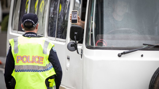 Police check cars for permits at a checkpoint in Coolangatta as the Queensland border re-opened to the southern states in July.