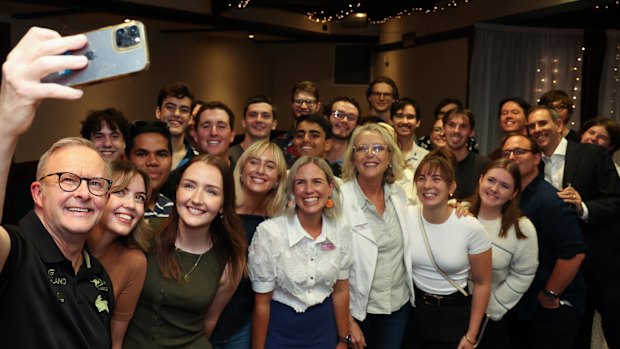 Anthony Albanese takes a selfie with Queensland University students and staff. Government policy has robbed young people of hundreds of thousands of dollars over the course of their working lives.