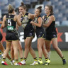 Ellie McKenzie celebrates a goal with Richmond teammates at GMHBA Stadium.