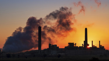 A coal-fired power plant is silhouetted against the morning sun in Glenrock, Wyoming. The Trump administration is rollingback Obama-era regulations designed to rein in climate-changing fossil-fuel emissions.