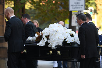Carla Zampatti’s coffin is carried out of St. Mary’s Cathedral.
