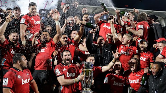 Spoils to the winners: The Crusaders celebrate their remarkable ninth Super title.