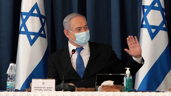 Benjamin Netanyahu wears a face mask to help prevent the spread of the coronavirus as he chairs the weekly cabinet meeting.