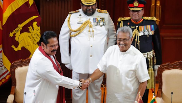 Sri Lanka's President Gotabaya Rajapaksa, right, greets his brother Mahinda after appointing him as Prime Minister on Thursday.