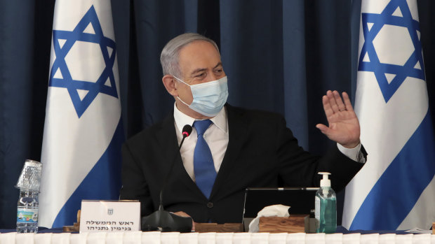 Benjamin Netanyahu wears a face mask to help prevent the spread of the coronavirus as he chairs the weekly cabinet meeting.