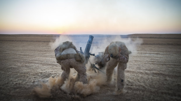 US Marines fire mortars from an undisclosed location in Syria before US President Donald Trump declared the Islamic State group defeated. 