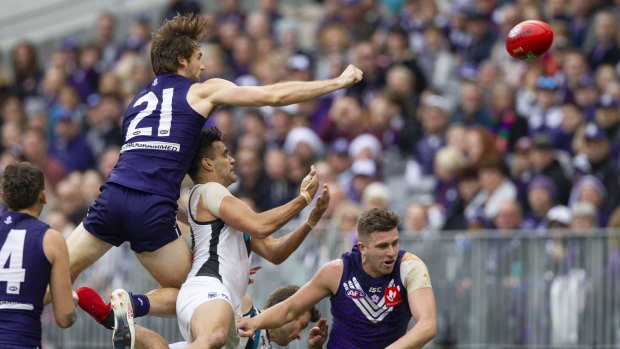 Fist fight: Joel Hamling climbs high over Port's Lindsay Thomas to effect a clearance.
