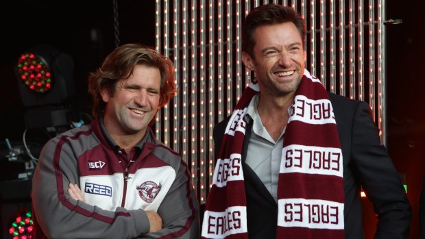 Sea Eagles fan Hugh Jackman talks to Manly coach Des Hasler in 2011.