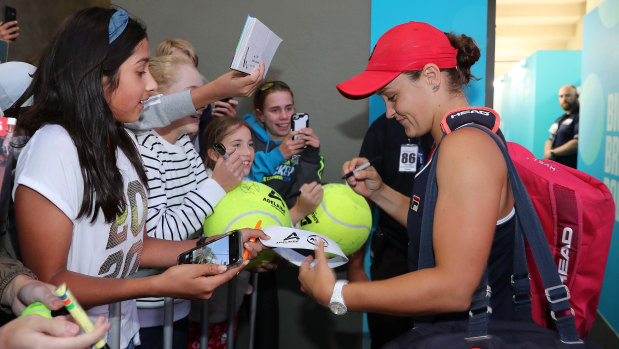 Ashleigh Barty signs autographs for young fans after winning her semi-final against Danielle Collins at the 2020 Adelaide International at Memorial Drive.