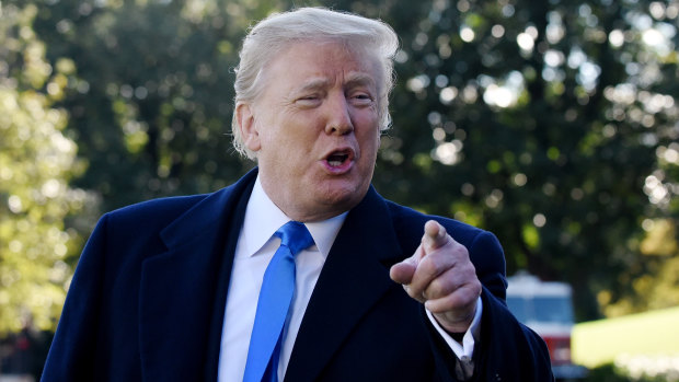 US President Donald Trump speaks to members of the media before boarding Marine One.