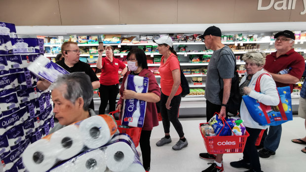 Australians rushed into supermarkets to hoard supplies in the coronavirus crisis.