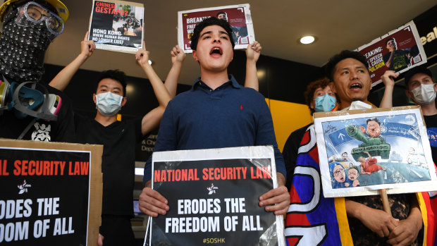 University of Queensland (UQ) student and activist Drew Pavlou (centre) takes part in a protest in support of Hong Kong, outside the Chinese consulate in Brisbane.