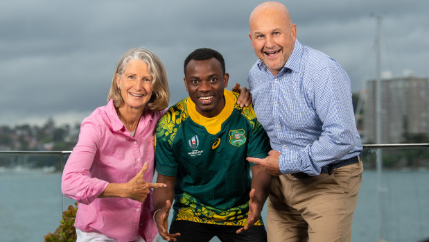 Burundian refugee David Nduwimana with Rugby Australia interim CEO Rob Clarke and wife Kylie Virtue-Clarke. 