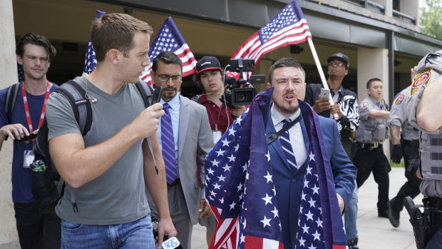 White supremacist Jason Kessler arrives at the Vienna metro station to travel to Washington on the first anniversary of their rally in Charlottesville.