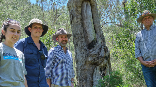 Insurance Council of Australia head Andrew Hall (third from left) with Taylor Clarke, Harry Burkitt from the Colong Foundation for Wilderness, and ICA’s Sean Gordon (right) beside a scar tree in an area likely to face inundation if the Warragamba Dam wall is raised.
