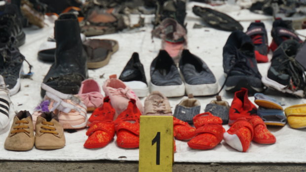 Baby shoes among the debris and personal belongings fished out of the sea by search and rescue teams and lined up at Tanjung Priok crisis centre after the crash of Lion Air flight JT610.