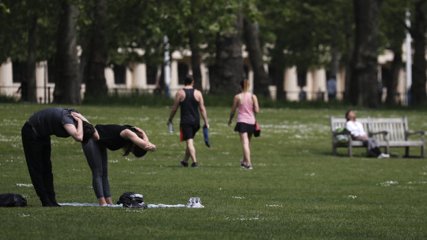 Time for a bit of exercise: People in St James Park in London.