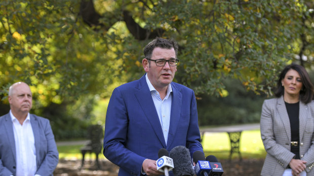 Premier Daniel Andrews flanked by Treasurer Tim Pallas and Consumer Affairs Minister Marlene Kairouz speak to media on Wednesday. 