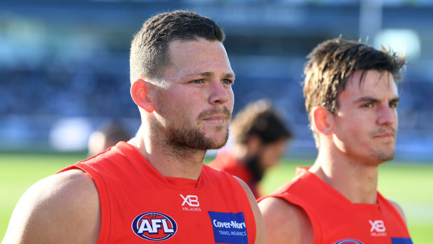 Gold Coast's Steven May (left) has met with Melbourne and is considering his future.