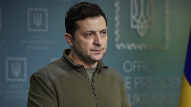 Ukrainian President Volodymyr Zelensky, in military garb, addresses his nation as Russian troops invade from across the countries’ shared border. 