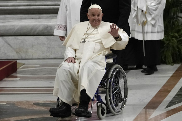 Pope Francis waves after presiding over the Easter Vigil celebration.