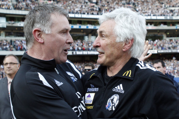 Geoff Walsh (left) and coach Mick Malthouse helped the Magpies to win the 2010 premiership.