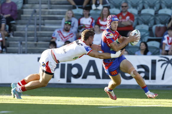 Newcastle skipper Kalyn Ponga is tackled during the loss to the Dragons at WIN Stadium.