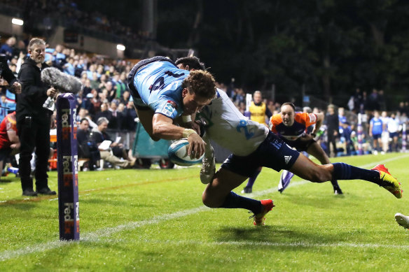 Mark Nawaqanitawase of the Waratahs scores a try against the Blues.