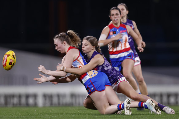The Bulldogs’ Sarah Hartwig  handballs during the clash with Fremantle.