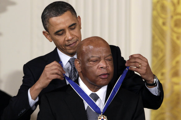 Then US President Barack Obama presents a 2010 Presidential Medal of Freedom to Democrat Congressman John Lewis.