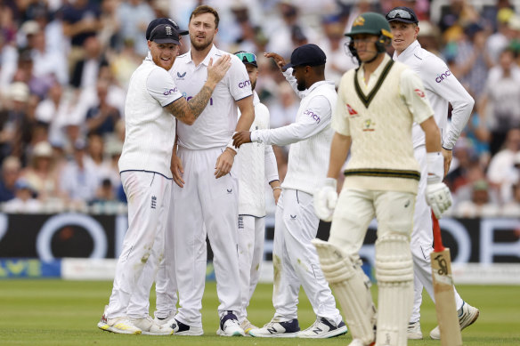 England’s Ollie Robinson celebrates with Ben Stokes after taking the wicket of Australia’s Marnus Labuschagne, caught by Jonny Bairstow.