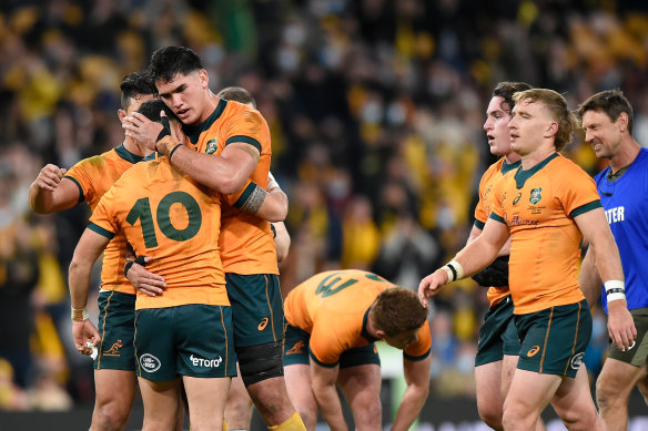 The Wallabies celebrate their after-the-siren win over France in Brisbane.