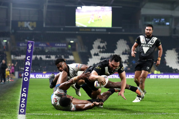 Jordan Rapana of New Zealand scores during the  Rugby League World Cup quarter-final.