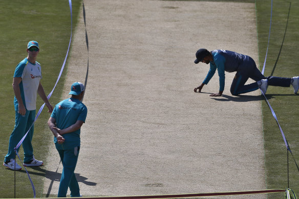 Pakistan’s skipper Babar Azam, right, and  Steve Smith inspecting the pitch at Rawalpindi.