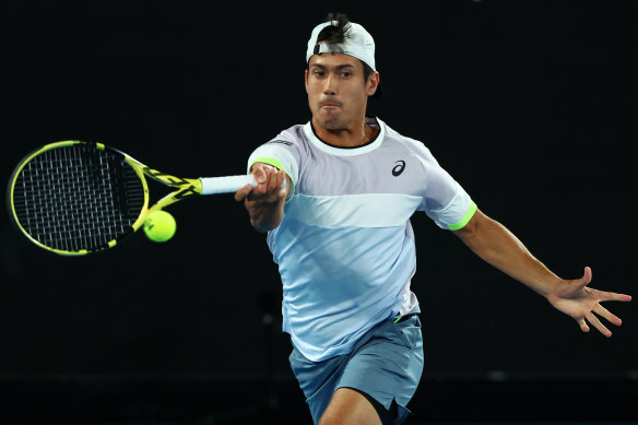 Kubler plays a forehand in the men’s doubles final of the Australian Open.
