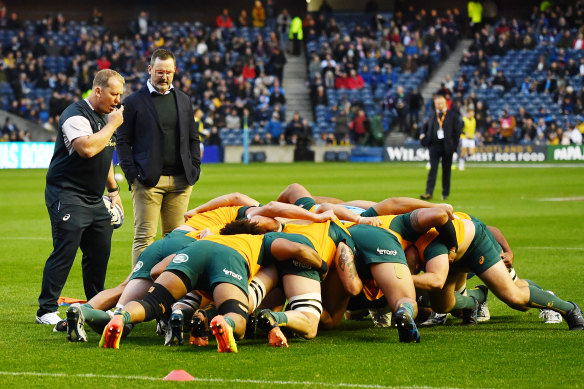 Petrus du Plessis (left) watches Australia warm-up before their Test against Scotland last month.