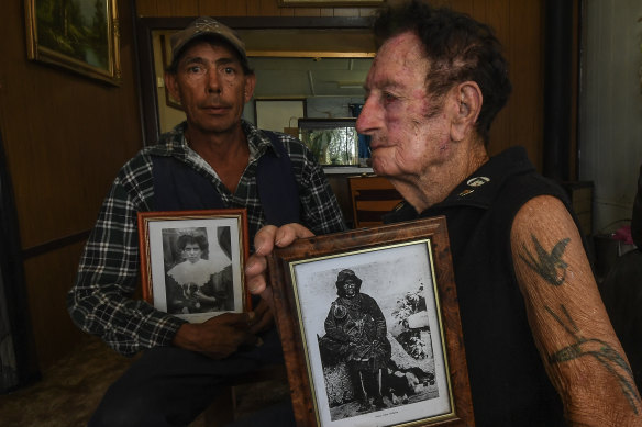 Rodney Dowling (left) with his father Fred and portraits of Fred's grandmother Annie Lewis and Mary Jane Milawa.