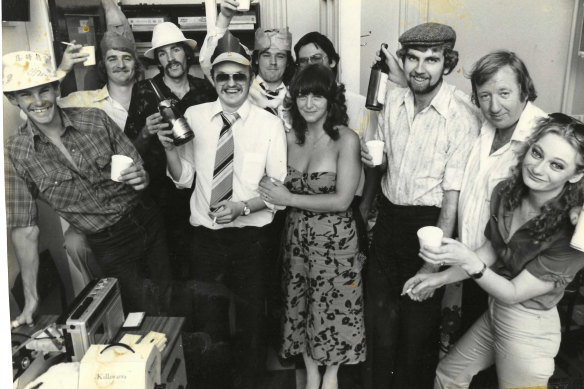 Police rounds Christmas party in the Russell Street pressroom, 1980. SIlvester, wearing an alarmingly wide tie, is in the middle.