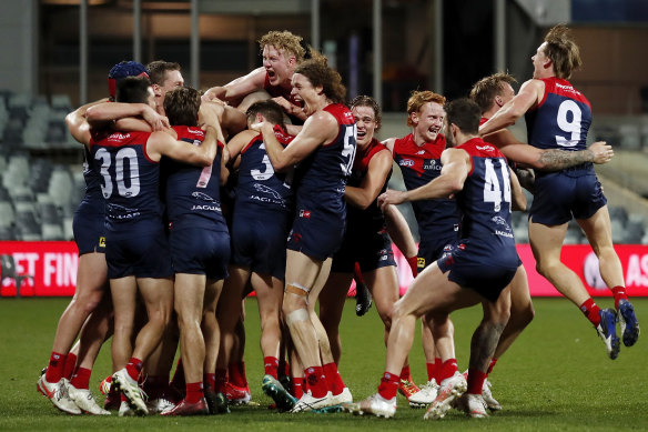 The Demons celebrate taking out the minor premiership.