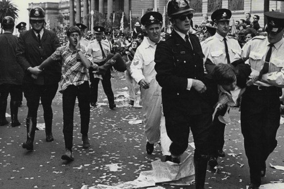 Police remove demonstrators from the  roadway outside the Art Gallery on October 22, 1966.