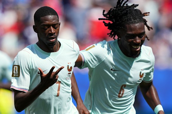 France’s Ousmane Dembele  reminds himself of his personal tally against Norway.