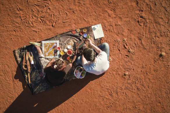 Learn from a local Anangu artist at a Maruku Arts Workshop.