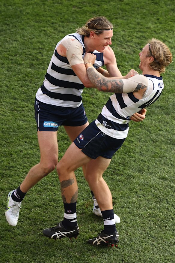 Tom Stewart celebrates with Mark Blicavs (left).